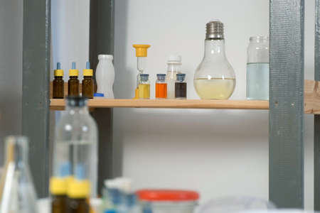 Home school chemistry class laboratory with reagents, jars, flasks and test tubes. Equipment for experiments. Homeschooling, education, science concept. Chemical classroom.の写真素材