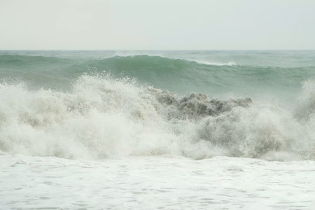Sea storm, power of huge crushing waves water, nature and seascape with foam in overcast weather....