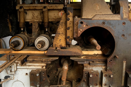 Industrial machine cutting wooden plank in lumber mill factory workshop. Wood manufacturing...