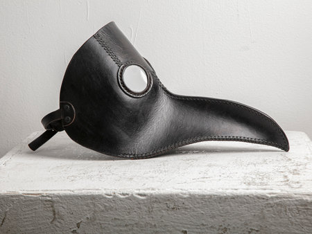 Black mask on a white background, close-up, isolateの写真素材