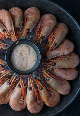 Boiled shrimps in a frying pan with sauce, top viewの写真素材