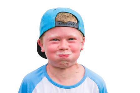 Small angry child boy try to hold breath getting red isolated on white background