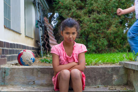 Child quarreling during play outsideの写真素材