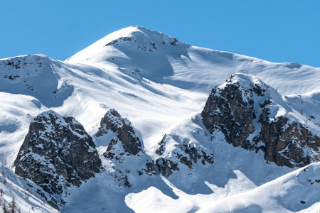 Mountain landscape with snow and clear blue sky. Caucasus Mountains, Georgia, region Gudauri.の写真素材