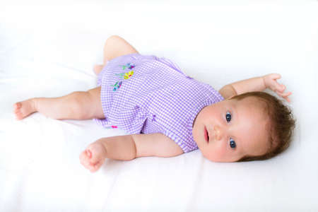 Sweet baby girl in a purple dress 