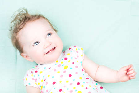 Funny baby with beautiful blue eyes 