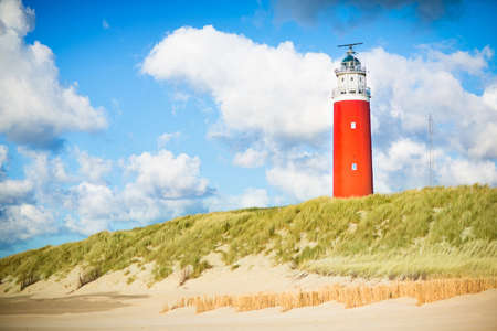 Beautiful red lighthouse of Texel island in the North Sea in Holland, Netherlandsの写真素材
