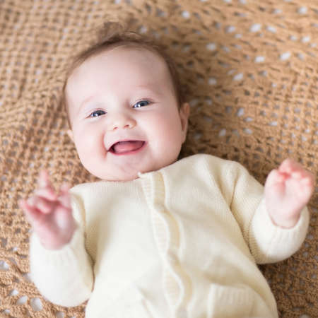Little baby on a knitted blanketの写真素材