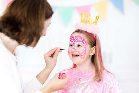 Face painting for little girl. Princess and fairy theme birthday party with face paint artist and...