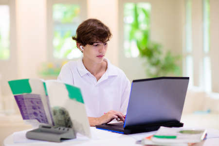 Homeschooling. Kids learning from home. Remote school, online education for high school child during...