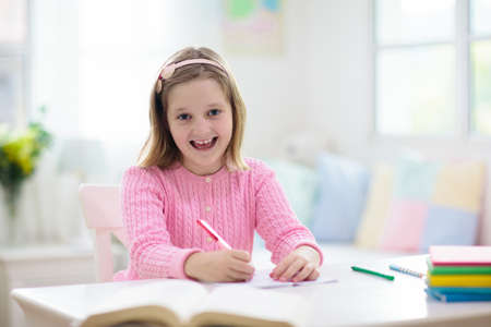 Kids go back to school. Children study and learn for preschool. Little girl of elementary class...