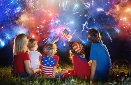 American family celebrating Independence Day. Picnic and fireworks on 4th of July in America. USA...