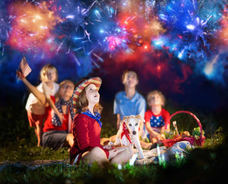 American family celebrating Independence Day. Picnic and fireworks on 4th of July in America. USA...