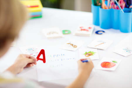 Kids learn to read. Colorful abc phonics flash cards for kindergarten and preschool children. Remote learning and homeschooling for young kid. Child reading sounds and letters. English lesson.の写真素材