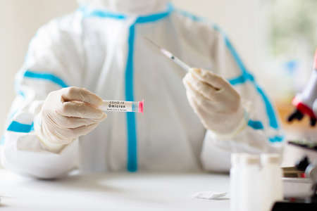Omicron variant of covid 19 testing. Coronavirus test in hospital laboratory. Doctor analyzing...