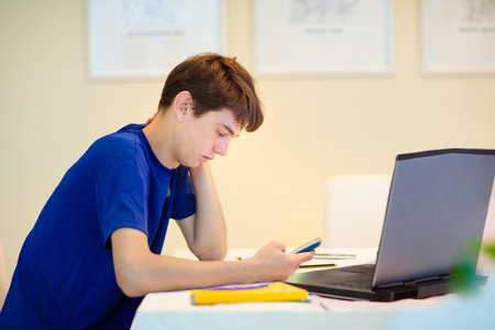 Homeschooling. Kids learning from home. Remote school, online education for high school child during...