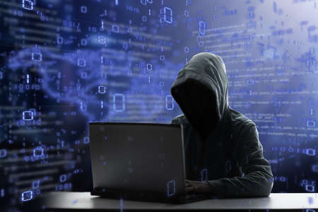 hacker at laptop. Malware and virus danger. Man in hoodie and dark mask hacking. Dark net and...