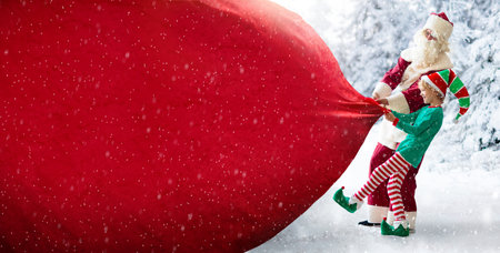 Santa and elf deliver Christmas presents. Santa Claus and little child pull a huge sack with gifts...