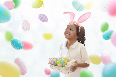 Kids dyeing Easter eggs. Children in bunny ears dye colorful egg for Easter hunt. Home decoration...