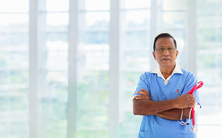 Asian doctor or nurse with stethoscope and face mask. senior medical specialist. hospital and clinic staff. Sickness prevention. health care professional.の写真素材