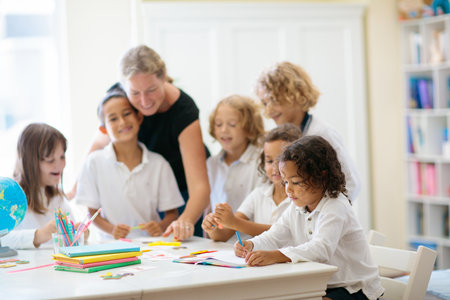 Kids go back to school. Interracial group of children of mixed age in the classroom. Students learn...