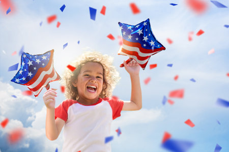 American family celebrating 4th of July. Laughing happy child watching Independence Day fireworks holding US flag balloons. Proud USA kids cheer and celebrate at party. Boy with America symbol.の写真素材