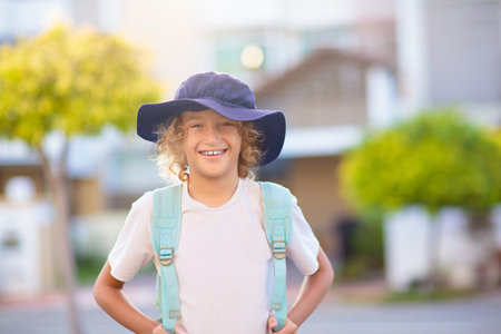 Children go back to school. Start of new school year after summer vacation. Boy with backpack and books on first school day. Beginning of class. Education for kindergarten and preschool kids.の写真素材