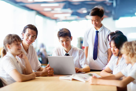 Kids go back to school. Interracial group of children of mixed age on the first day of new academic...