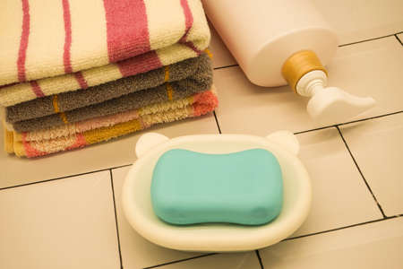 Soap towel shower gel in bathroom on white background
