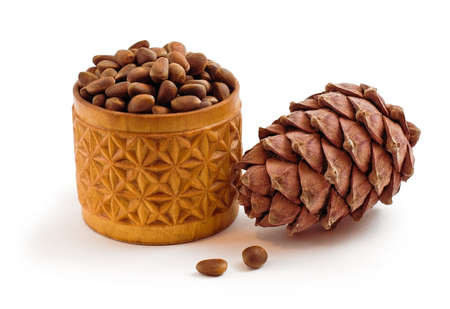 pine cones and pine nuts isolated on a white background の写真素材