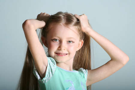 smiling girl looks in a cameraの写真素材