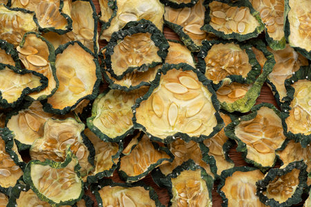 Texture of cucumber dried slices on wooden backgroundの写真素材