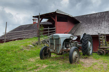 Tractor in front of the farmの写真素材