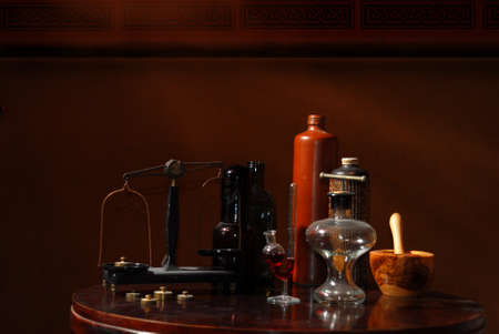 old pharmacistÂ´s stuff, bottles, scales and mortarの写真素材