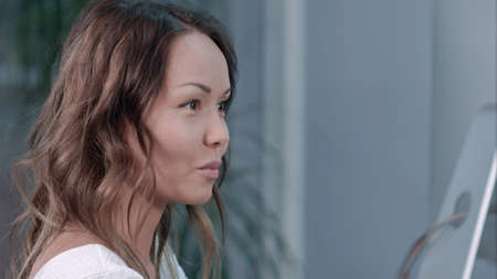 Asian businesswoman talking with partners in the officeの写真素材