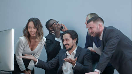 Happy multiracial group of businesspeople celebrating their successの写真素材