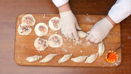 Preparing seafood dumplingsの写真素材