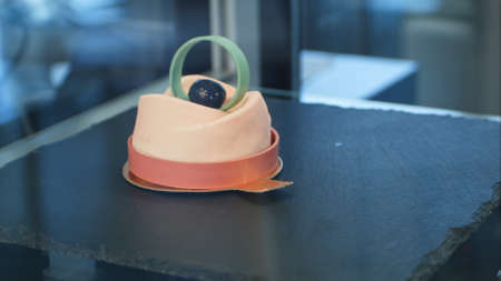 Small beautifull cupcake on black shop-windowの写真素材