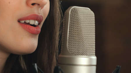 Female singer and microphoneの写真素材