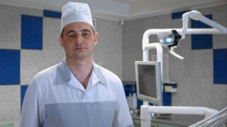 Worried man doctor looking at cameraの写真素材