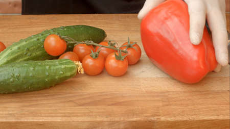 Fresh vegetables in kitchen on wooden tableの写真素材