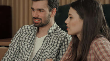 Young couple talking in cafeの写真素材