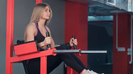 Fitness woman working out in the gymの写真素材
