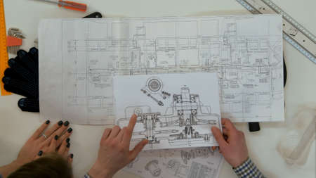 Young architects working on blueprintsの写真素材