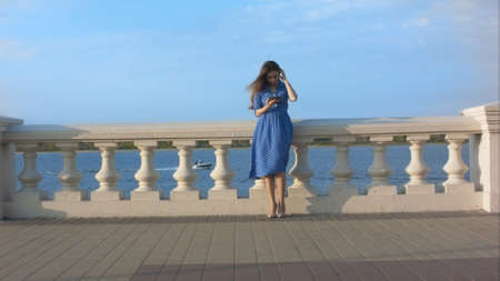 Woman outdoor using digital tablet.の写真素材