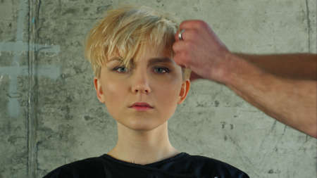 Young woman getting new hairdress.の写真素材