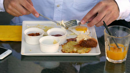 Breakfast time with eggs in cafeの写真素材