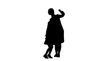 Silhouette Smiling mother and daughter bonding together to take a selfie track matteの写真素材