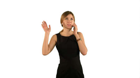 Portrait of happy young Woman Talking On Mobile Phone on white background isolatedの写真素材