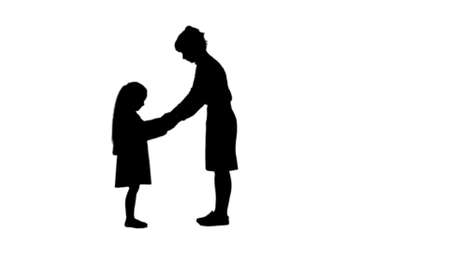 Silhouette Beautiful young mom giving a present to her charming little girl track matteの写真素材